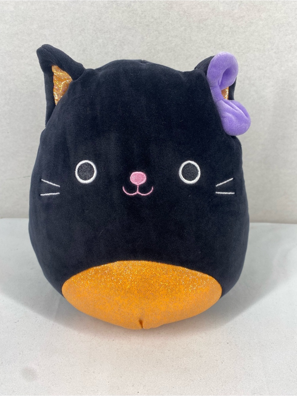 Squishmallows Autumn Black Cat Plush with Orange Sparkle Belly & Purple Ear Bow